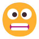 grimacing